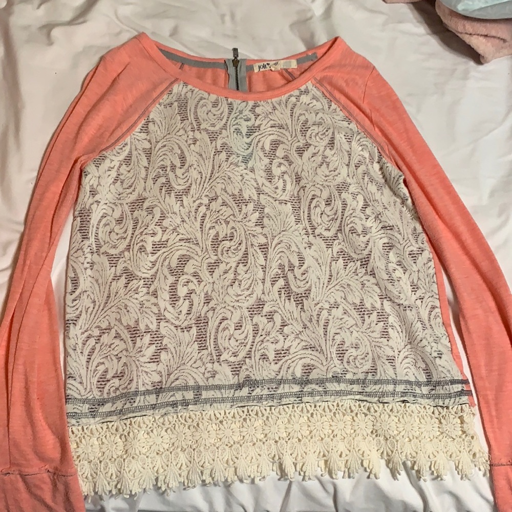 Long sleeve shirt that is white/cream with pink sleeves and back